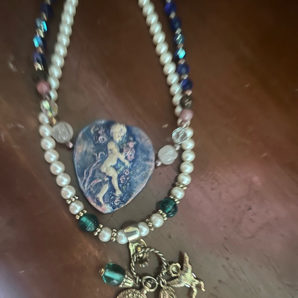 2 angel themed necklace